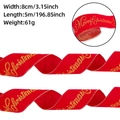 Vue détaillée du ruban de Noël en velours rouge avec inscription dorée Joyeux Noël de luxe - Rouge (8CM Largeur x 5M)