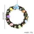 Easter rattan wreath with colorful speckled eggs and a blue plush bunny mascot - Blue