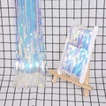 Dettaglio della tenda a frange olografica laser con riflessi arcobaleno iridescenti - 1m*3m Tinsel Arcobaleno