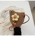 Brown woven straw bucket bag featuring a large yellow flower charm and brown strap - Khaki Flowers