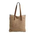 Elegante bolso tote de paja tejida beige con asas de cuero marrón y patrones calados - Beige
