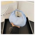 Light blue quilted crescent bag with silver chain strap and metal clasp closure - Blue