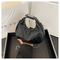 Chic black quilted half-moon hobo bag with silver chain strap and metal lock closure - Black