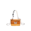 Metallic orange mini crossbody bag with silver butterfly and pearl heart handle - Orange