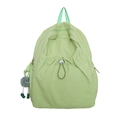 Zaino in nylon verde menta con tasca frontale a coulisse e ciondolo mostro di peluche - Verde