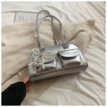 Silver metallic PU leather shoulder bag with pearl bow and heart pendant on a soft background - Silver (No Pendant)