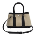 Minimalistische Tote-Bag aus beigem Canvas mit schwarzem Lederbesatz und verstellbarem Riemen - Schwarz