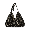 Bolso hobo de lona negra con estampados de lazos beige y correa ancha de hombro - Lazo Negro