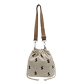 Bolso tipo cubo de lona beige con cordón y patrones negros del signo de dólar - Blanco Roto