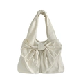 Chic cream white canvas handbag featuring a large bow decoration and knotted shoulder strap - Off White