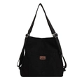 Versatile black corduroy shoulder bag with adjustable straps and a leather logo patch - Black