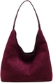 Macro shot of minimalist wine red faux suede hobo bag with vintage shoulder strap texture - Burgundy