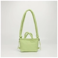 Detail view of light green quilted nylon drawstring bag with dual strap textures - Light Green