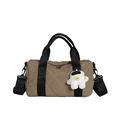Khaki quilted nylon bucket bag with black handles and astronaut plush charm - Khaki