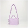 Detailed macro view of the light purple quilted nylon fabric and drawstring knot texture - Purple