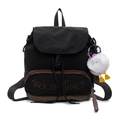 Black fabric backpack with Trick or Treat embroidery and cute plush monster charm accessory - Black
