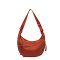 Minimalist terracotta dumpling crossbody bag with adjustable strap and nylon texture - Orange