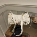 Modern creamy white baguette shoulder bag with silver buckles and smooth glossy finish - White