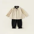 Retro two-piece girl's set with beige puff-sleeve top and black bloomers trousers - Size 80 / Beige & Black