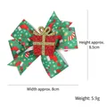 Christmas hair clip with green ribbon bow featuring holiday patterns and a gift box center - Christmas Gift Box