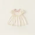 Cremeweißes Baby Mädchen Kleid mit rosa Peter-Pan-Kragen und Schleifendetails - 90 / Aprikose