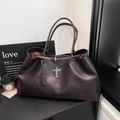 Detail shot of the dark brown PU leather tote bag with vintage silver cross charm - Brown