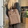 Dark brown woven texture business backpack with silver rabbit logo and side pockets - Coffee