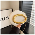 Detail of white matte evening bag featuring a distinctive golden oval metal handle - White