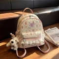 Sac à dos rose et beige avec imprimés lapins mignons et détails en dentelle blanche - Rose avec pendentif