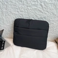 Quilted black laptop sleeve with horizontal padding and dual metal zipper closure - Black