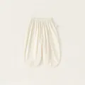 Pantalones anchos de algodón para niña en blanco crema con cintura elástica y aberturas - 80 / Blanco Roto