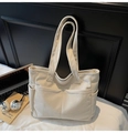 Detail of light beige corduroy tote bag showing side pockets and reinforced stitching - One Size / Off White