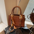 Brown leather tote bag with teddy dog embossing and woven handle for women - Brown with Pendant