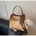 Close-up of vintage bucket bag with silver metal buckle and cute plush rabbit charm - With Pendant / Khaki