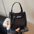 Retro black bucket bag with silver twist lock and a cute white plush pendant accessory - With Pendant / Black