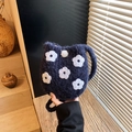 Navy blue plush bucket bag with white floral embroidery and soft pompom detail - Dark Blue