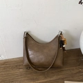 Brown vintage hobo bucket bag with wooden bead charm and smooth leather texture - Brown (With Charm)
