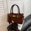 Deep brown matte suede handbag featuring a gold heart buckle and adjustable shoulder strap - Brown