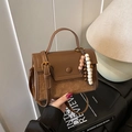 Brown leather crossbody bag with suede patchwork and decorative bohemian beaded charms - Brown