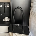 Minimalist black suede pillow bag with dual zippers and smooth leather straps for women - Black