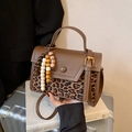 Brown vintage handbag with leopard print panel and decorative beaded charm accessory - Leopard Brown