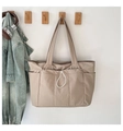 Detail view of khaki large capacity tote bag with white drawstring and side pockets - One Size / Khaki