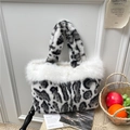 Chic black and white leopard print faux fur tote bag with plush white trim accents - White