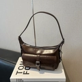 Dark brown retro pillow bag in oil-wax leather with silver buckle and metallic ring - Brown