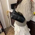 Retro black glossy leather underarm bag with front pocket shown on a model - Black