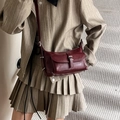 Women's burgundy matte leather pillow bag with silver buckle and crossbody strap - Red
