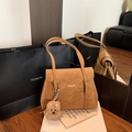Chic brown faux leather tote bag with plush bear charm and minimalist metal lettering - Brown with Pendant
