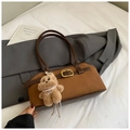 Detail of brown contrast shoulder bag with golden metal buckle and cute plush bear pendant - With Charm / Brown