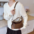 Minimalist dark brown crossbody bucket bag with bohemian tassel charm for women - With Charm / Brown