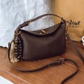Dark brown leather bucket bag with bohemian tassel charm and adjustable strap - With Charm / Brown